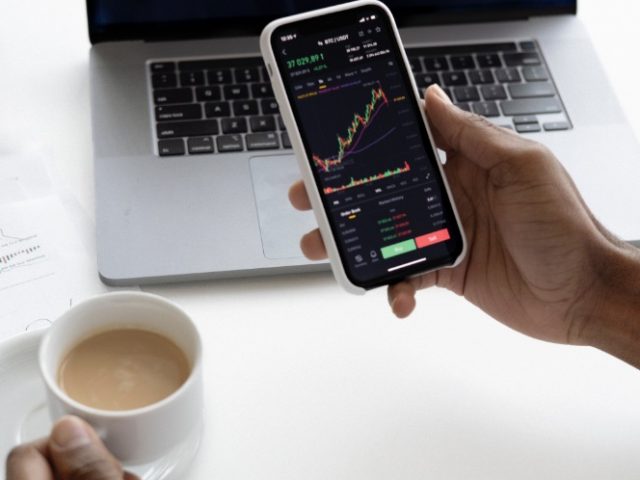 guy looking at stock charts